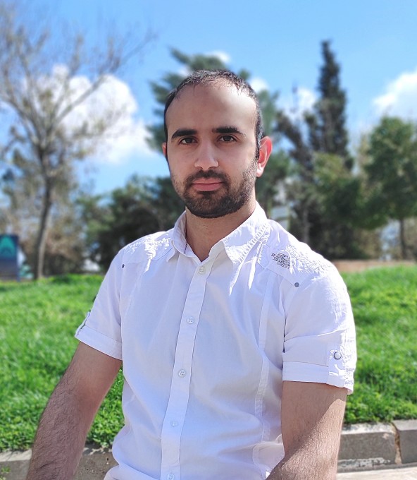 Muaz looking with confidence in a green environment